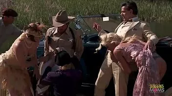Play Criminals have fun during an outdoors group sex session with the blonde and brunette milfs with big boobs